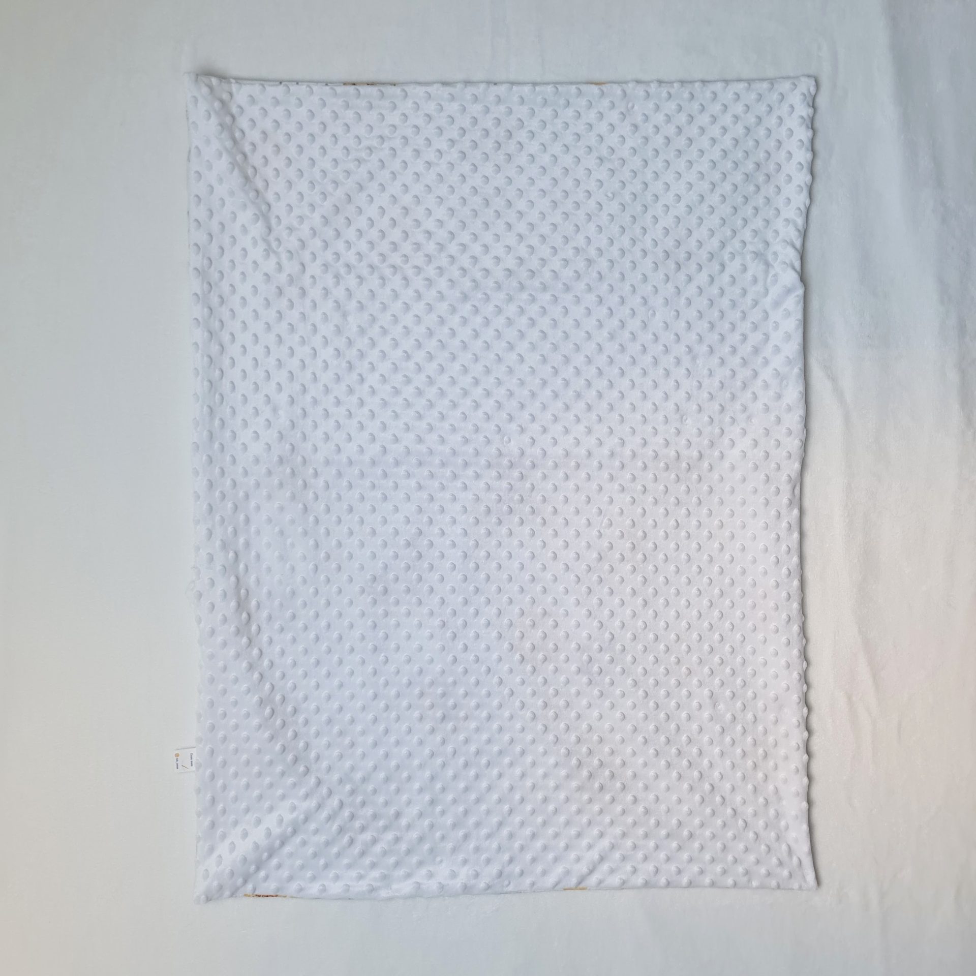 couverture vue côté minky tout doux blanc